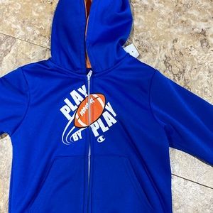 Champions zip up hooded jacket. Boys size 5. (6/5)